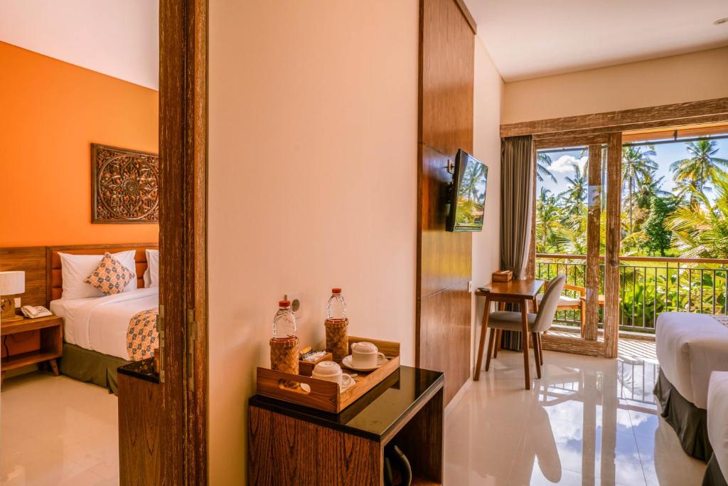 Postel nebo postele na pokoji v ubytování Kahayana Suites Ubud