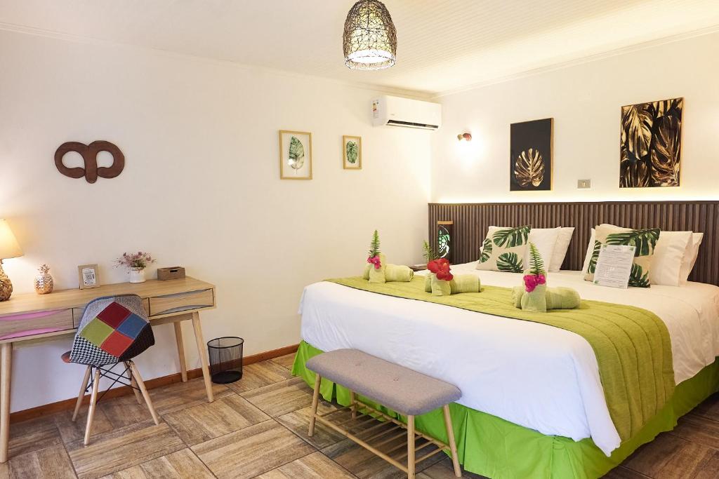 Postel nebo postele na pokoji v ubytování Hare Nua Hotel Boutique
