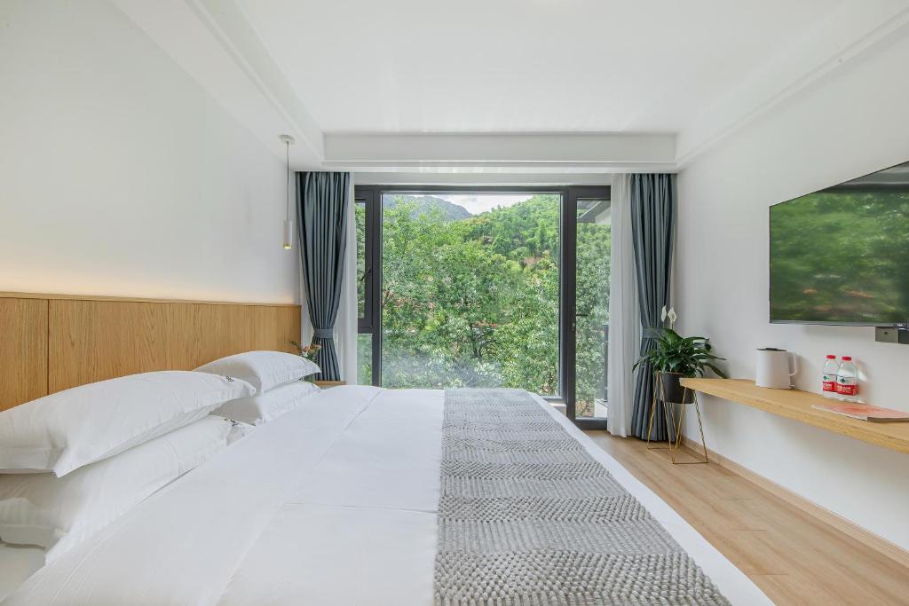 安吉季意民宿 Jiyi Boutique Homestay, Anji, Huzhou 객실 침대