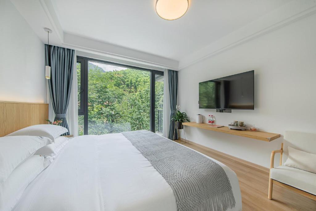安吉季意民宿 Jiyi Boutique Homestay, Anji, Huzhou 객실 침대