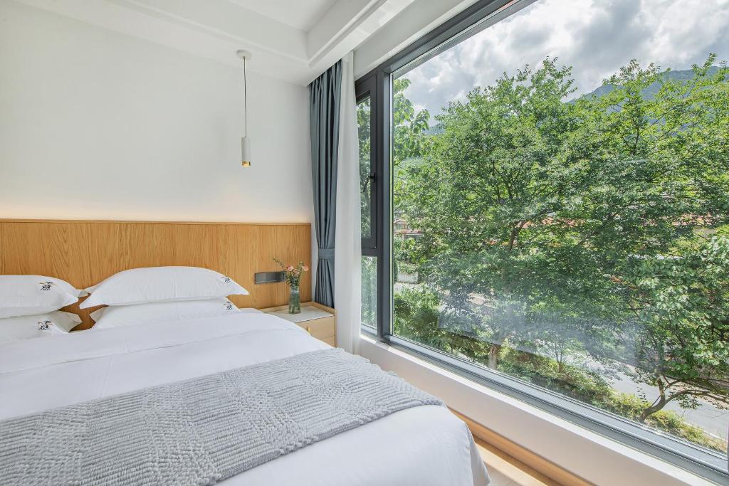 安吉季意民宿 Jiyi Boutique Homestay, Anji, Huzhou 객실 침대