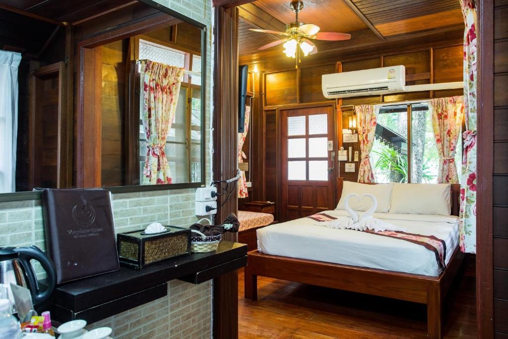Postel nebo postele na pokoji v ubytování Vongdeuan Resort