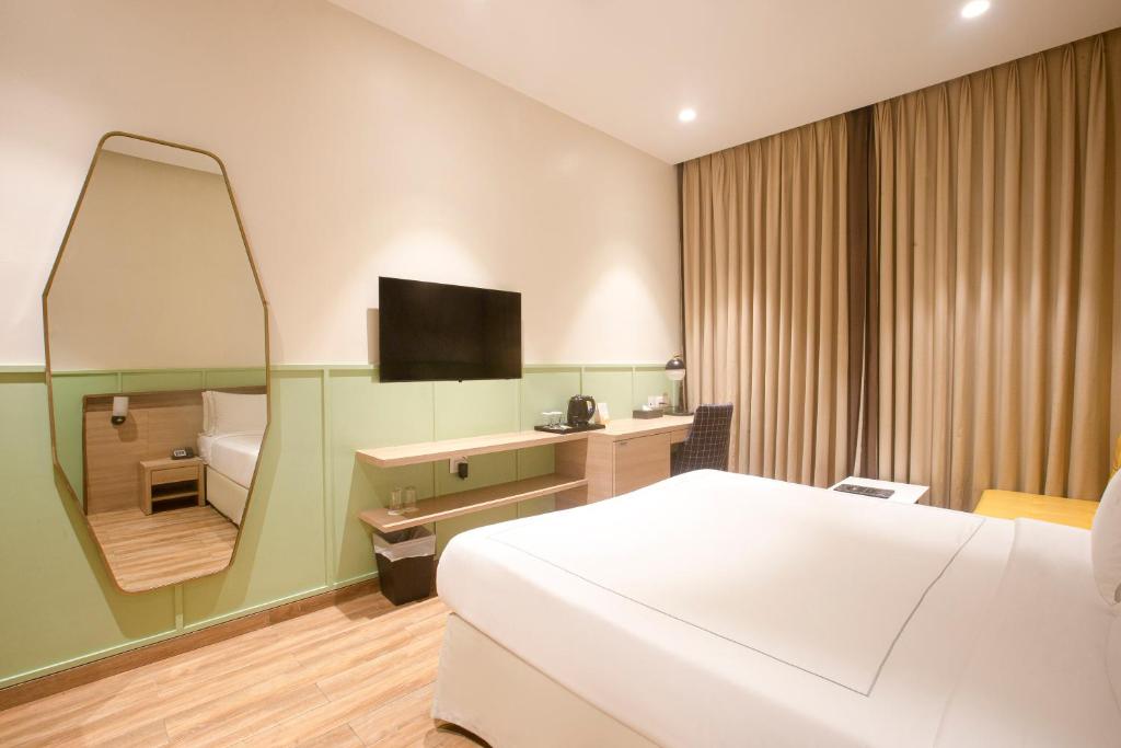 TV a/nebo společenská místnost v ubytování Hotel Bawa Regency