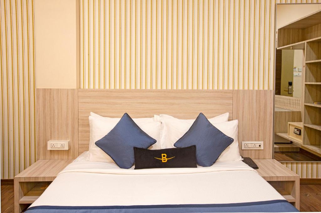 Postel nebo postele na pokoji v ubytování Hotel Bawa Regency