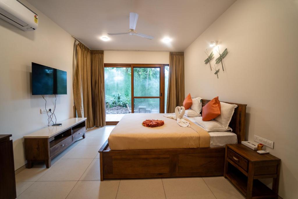 Postel nebo postele na pokoji v ubytování The Birchwood Retreat, Madikeri