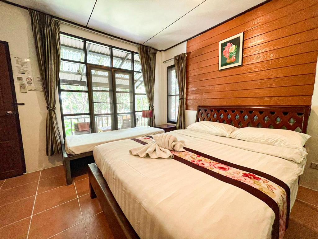 Postel nebo postele na pokoji v ubytování Vongdeuan Resort