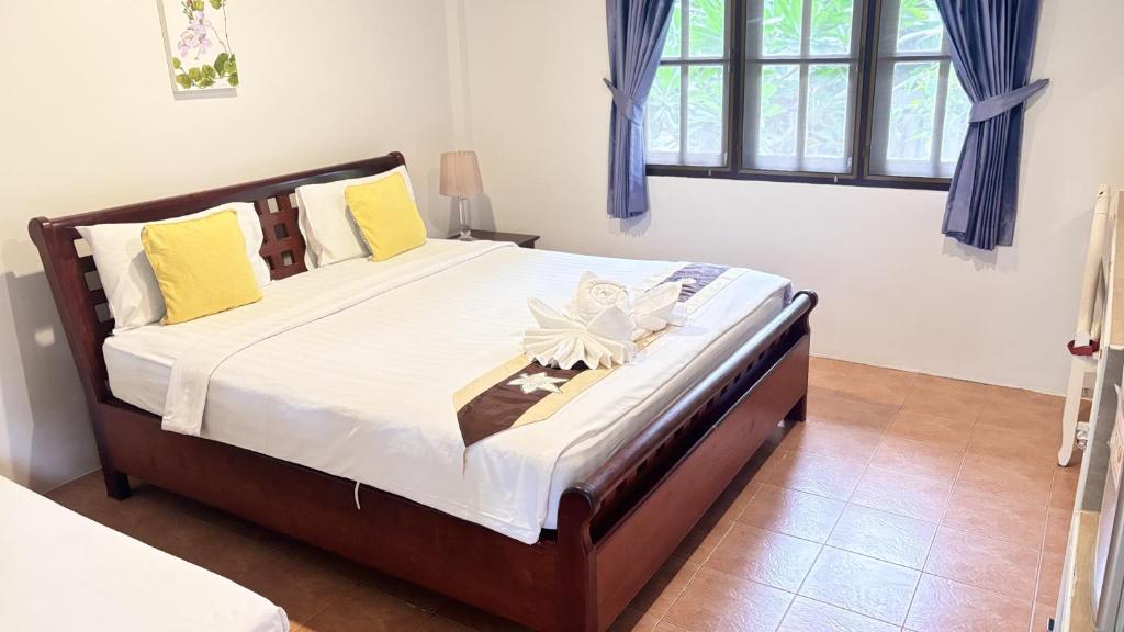 Postel nebo postele na pokoji v ubytování Vongdeuan Resort