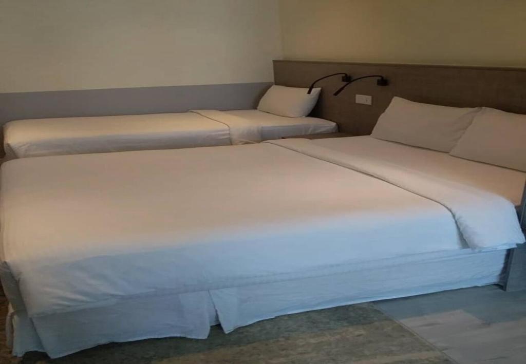 Postel nebo postele na pokoji v ubytování Hutton Suite Hotel Managed by The Ascott Limited