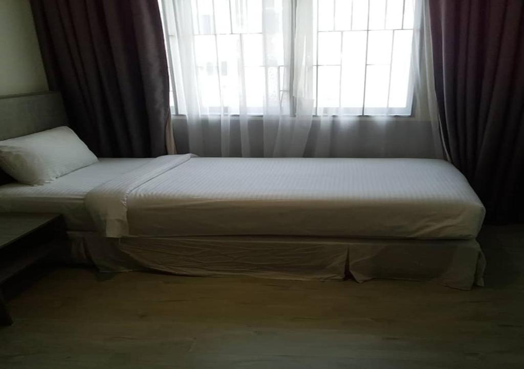 Postel nebo postele na pokoji v ubytování Hutton Suite Hotel Managed by The Ascott Limited