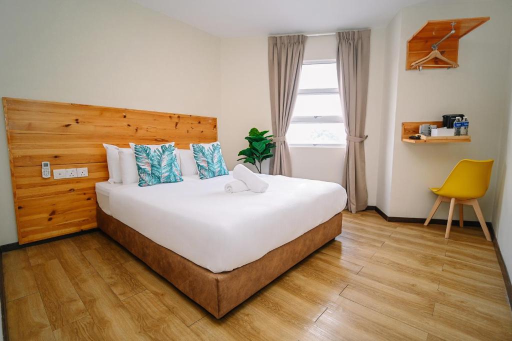 Postel nebo postele na pokoji v ubytování Swing & Pillows - Apple Hotel Shah Alam