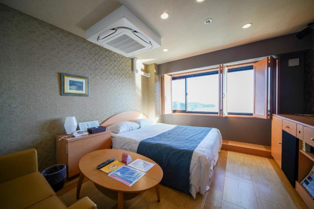 Postel nebo postele na pokoji v ubytování ホテル ラヴィアン HOTEL Lavien