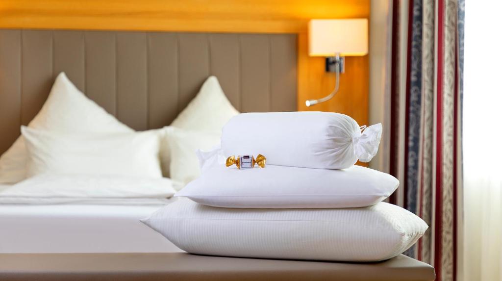 Postel nebo postele na pokoji v ubytování Hotel Löwengarten