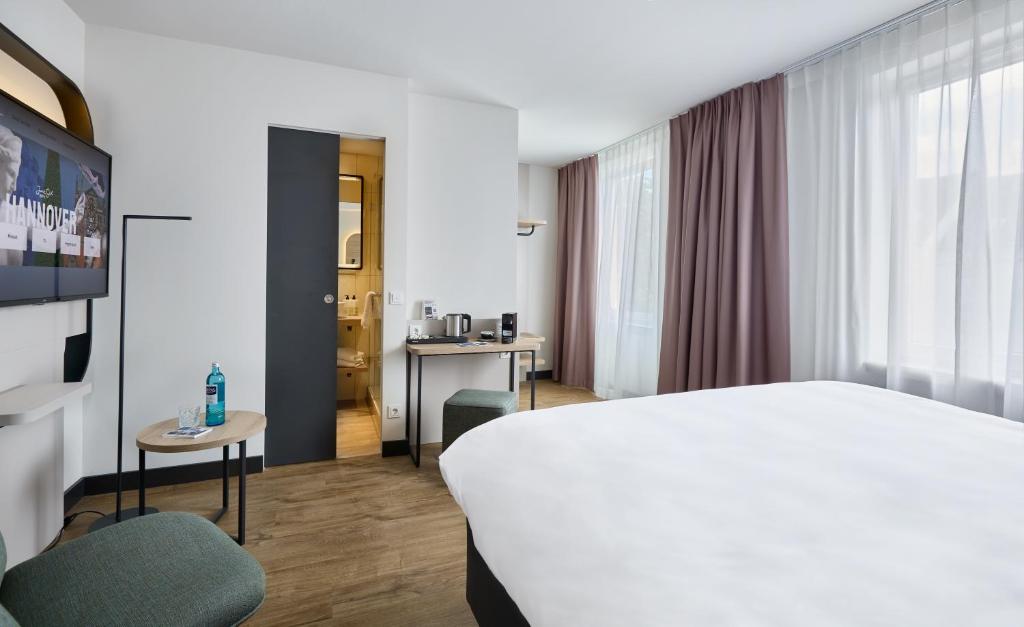 Postel nebo postele na pokoji v ubytování June Six Hotel Hannover City