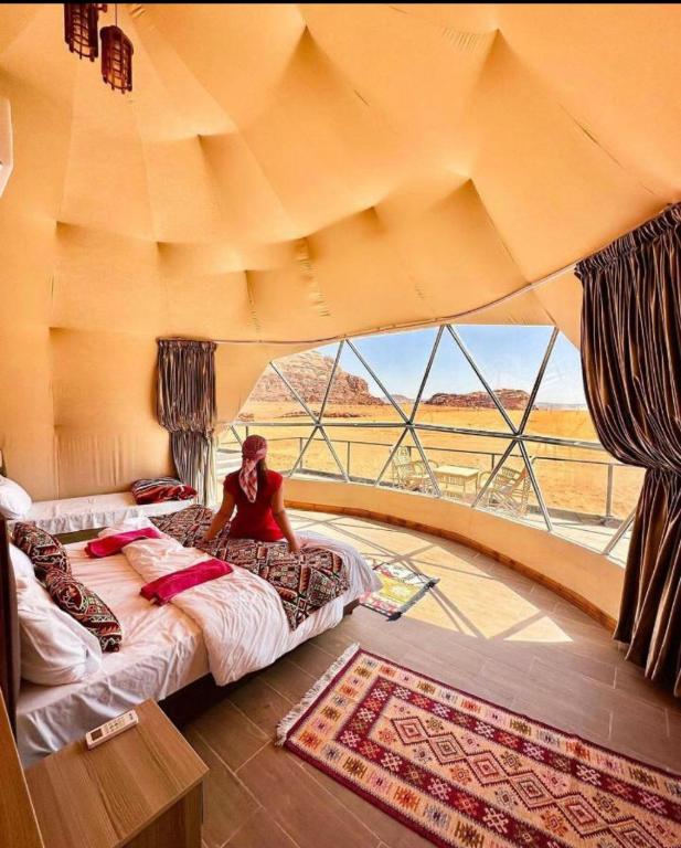 Voodi või voodid majutusasutuse Youssef camp Wadi Rum toas