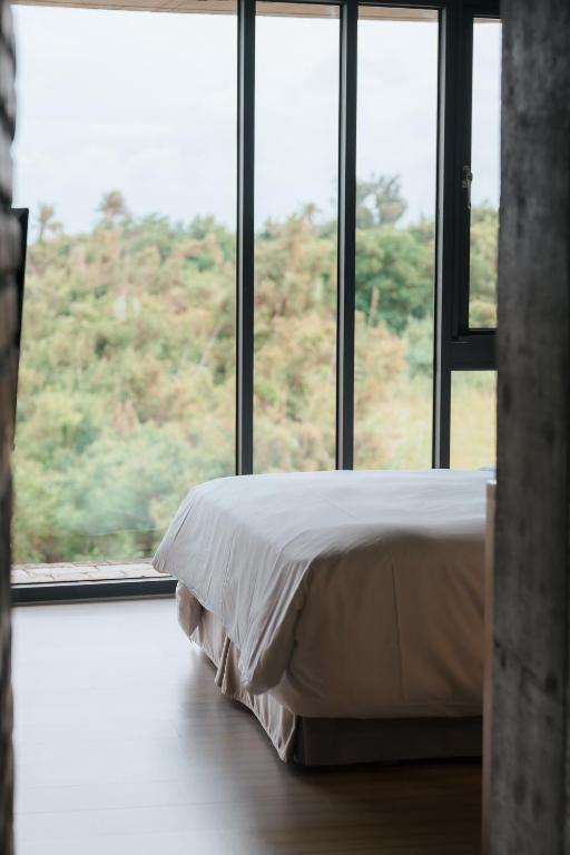 A bed or beds in a room at The Light