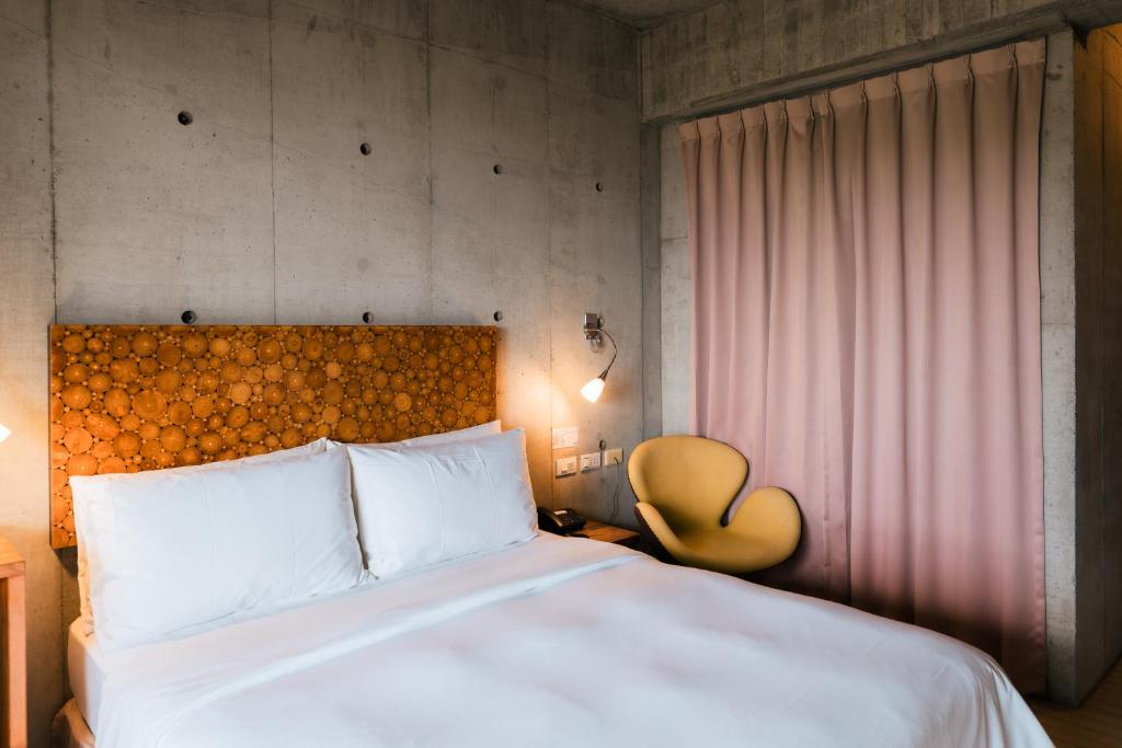 A bed or beds in a room at The Light