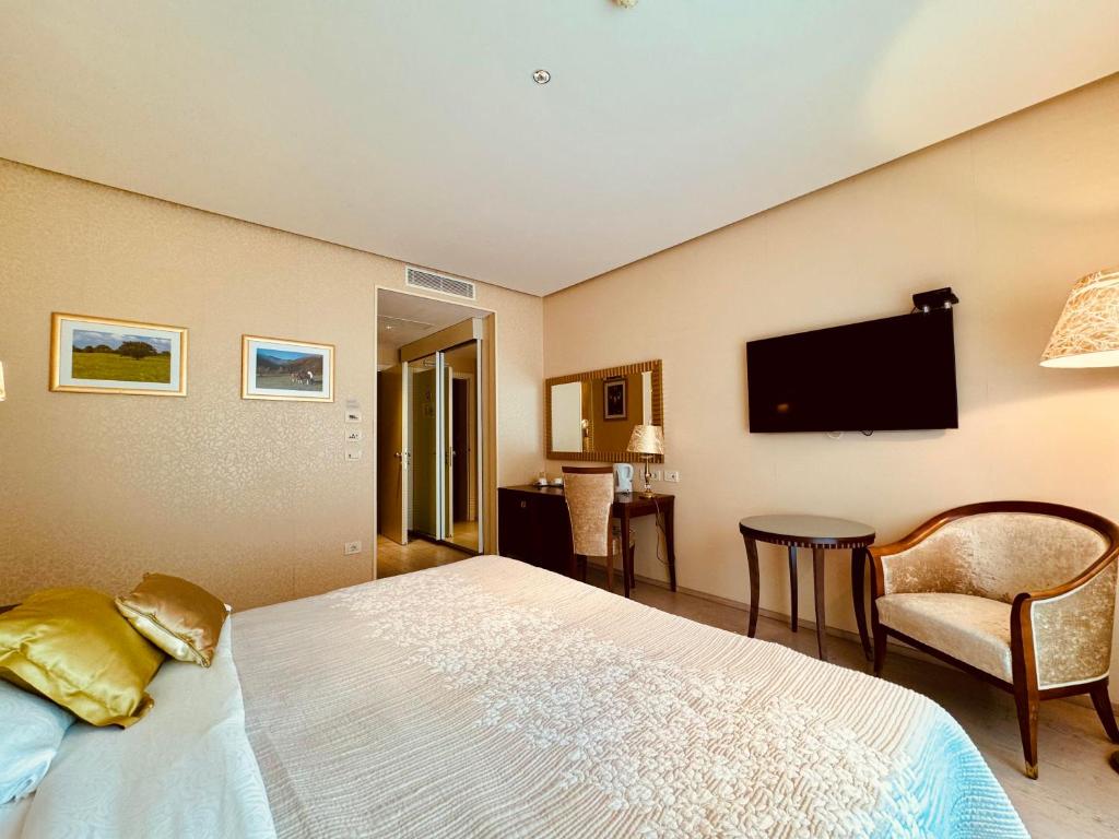 TV a/nebo společenská místnost v ubytování Boutique Hotel Oasi