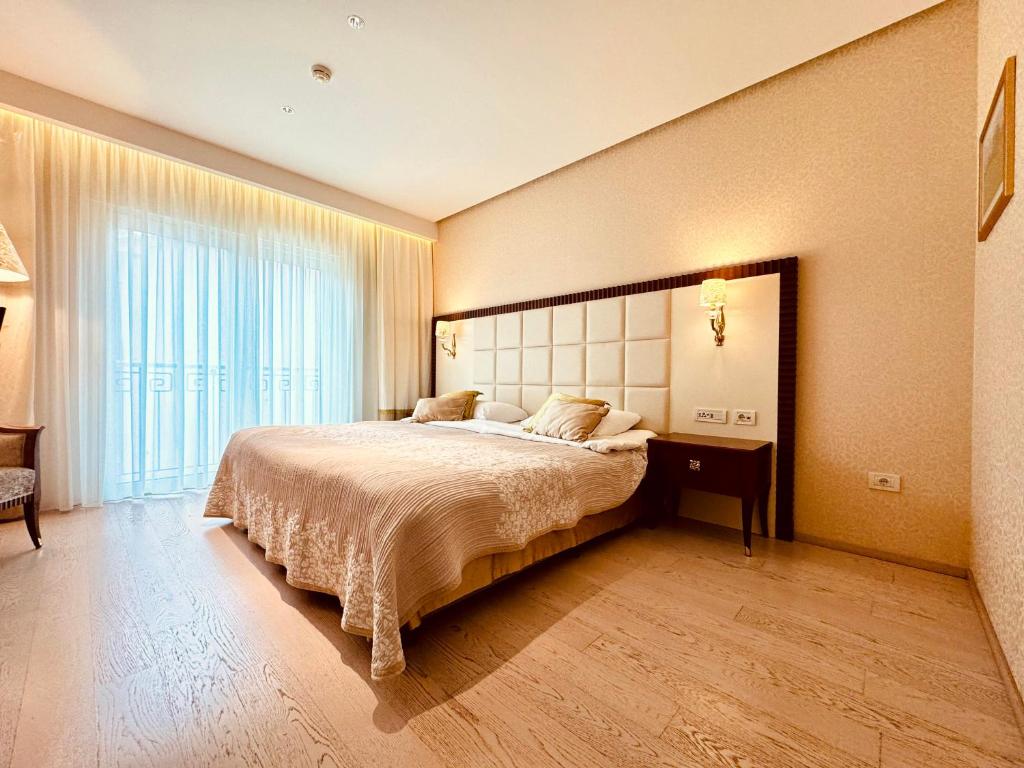 Postel nebo postele na pokoji v ubytování Boutique Hotel Oasi