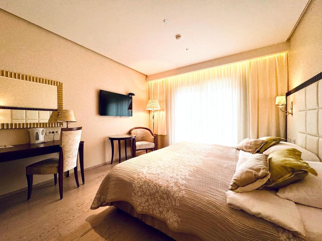 Postel nebo postele na pokoji v ubytování Boutique Hotel Oasi