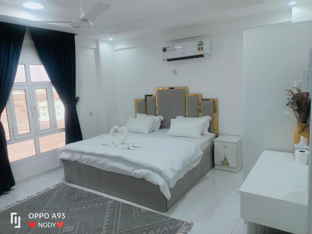 Postel nebo postele na pokoji v ubytování ANTIKA HOTEL / انتيكا للشقق الفندقيه
