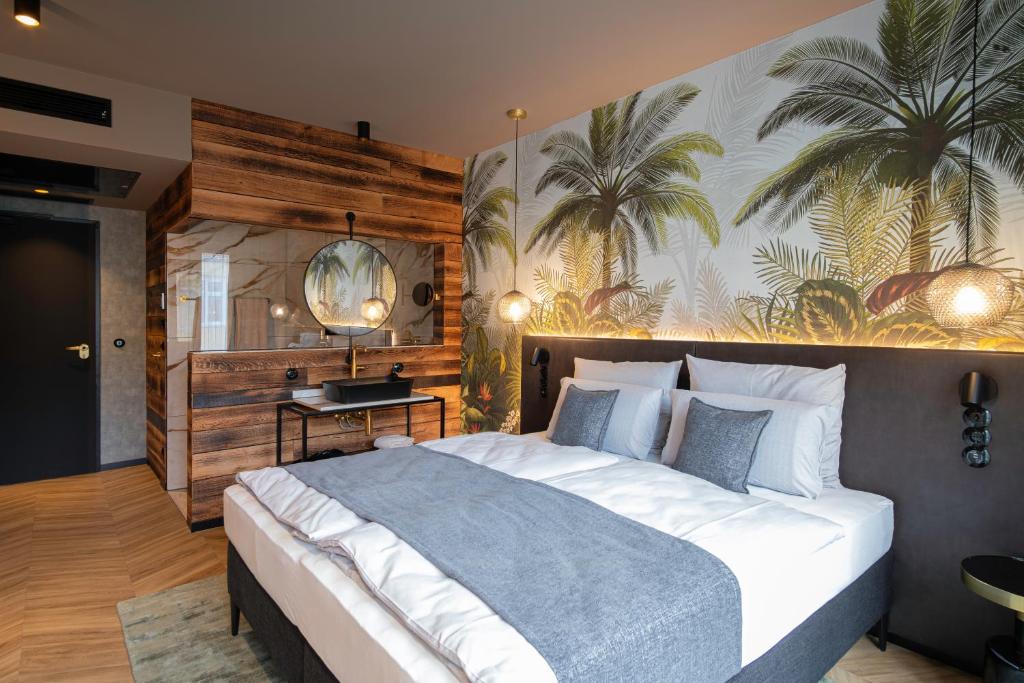 Postel nebo postele na pokoji v ubytování AMIA Hotel Singen