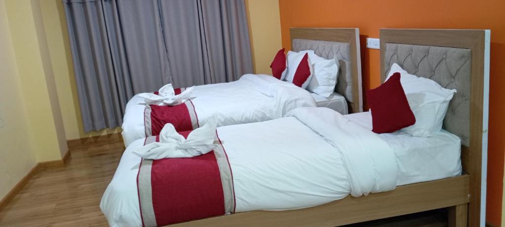 Postel nebo postele na pokoji v ubytování Rambler's Hotel
