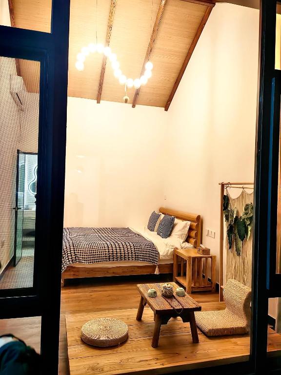 Postel nebo postele na pokoji v ubytování Gubeikou Great Wall Yunyeshu Boutique Guesthome