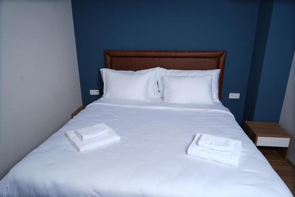 Postel nebo postele na pokoji v ubytování Eikon Apartments Abastumani