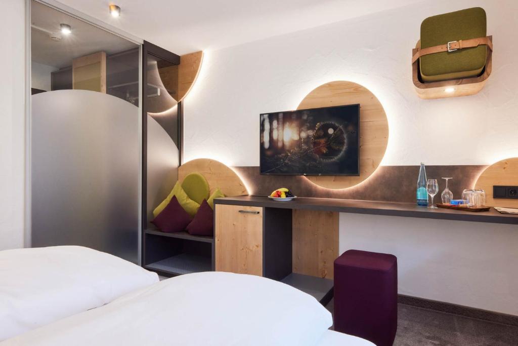 Postel nebo postele na pokoji v ubytování Hotel Sonne Post mit Schwimmbad