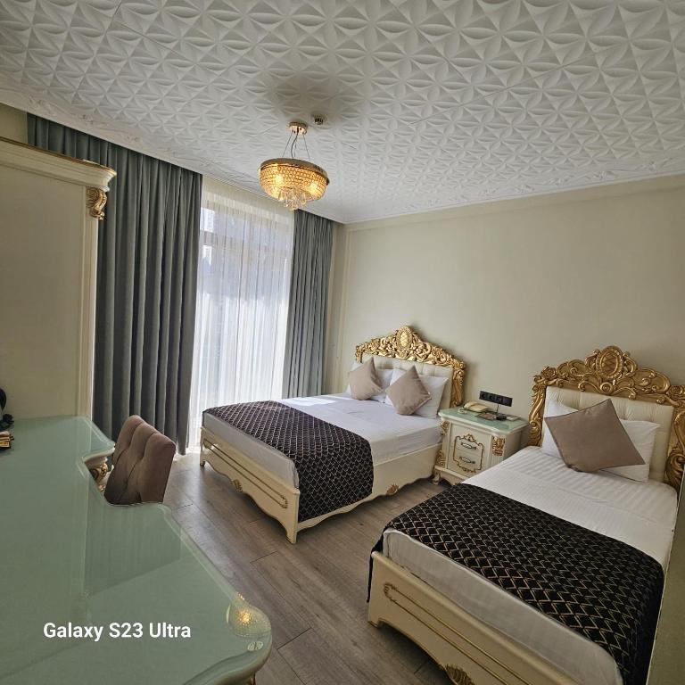 Postel nebo postele na pokoji v ubytování Best Town Hotel