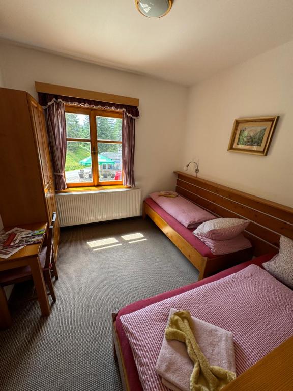 Postel nebo postele na pokoji v ubytování bouda Pod Sněžkou