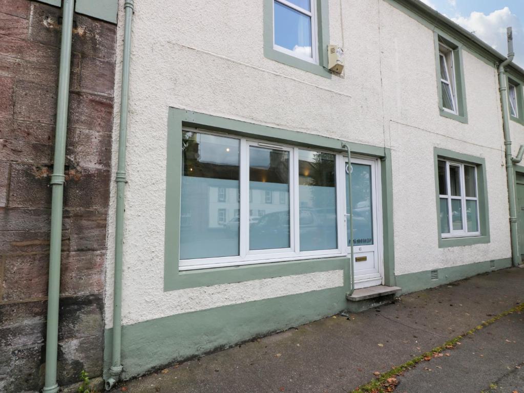 a white building with a window on the side of it at West Morton Suite in Thornhill