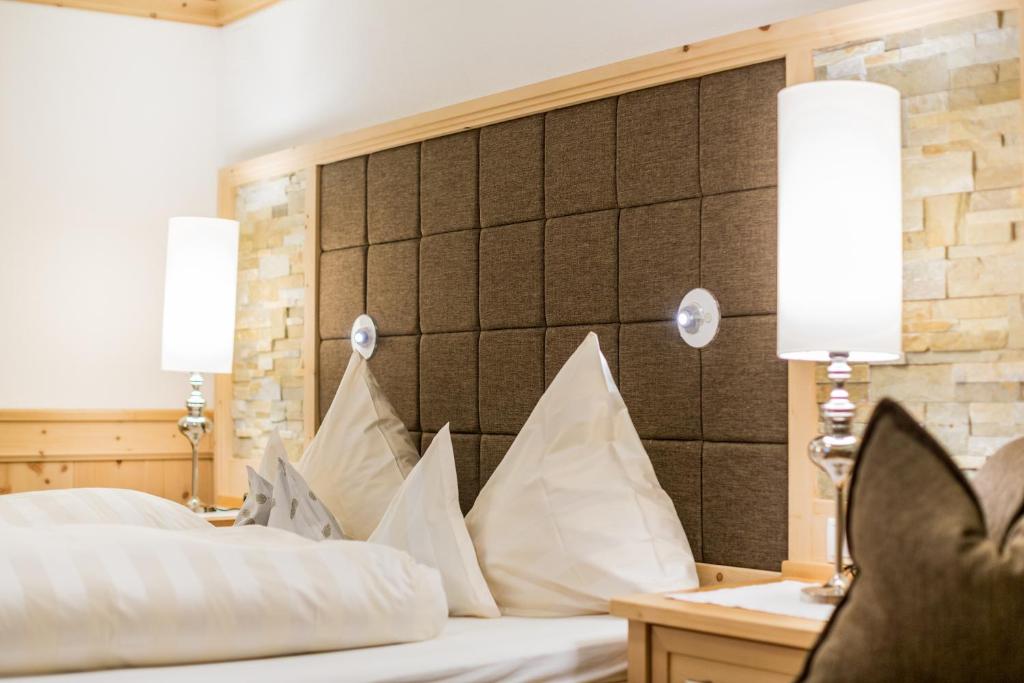 Postel nebo postele na pokoji v ubytování Biohotel Schweitzer