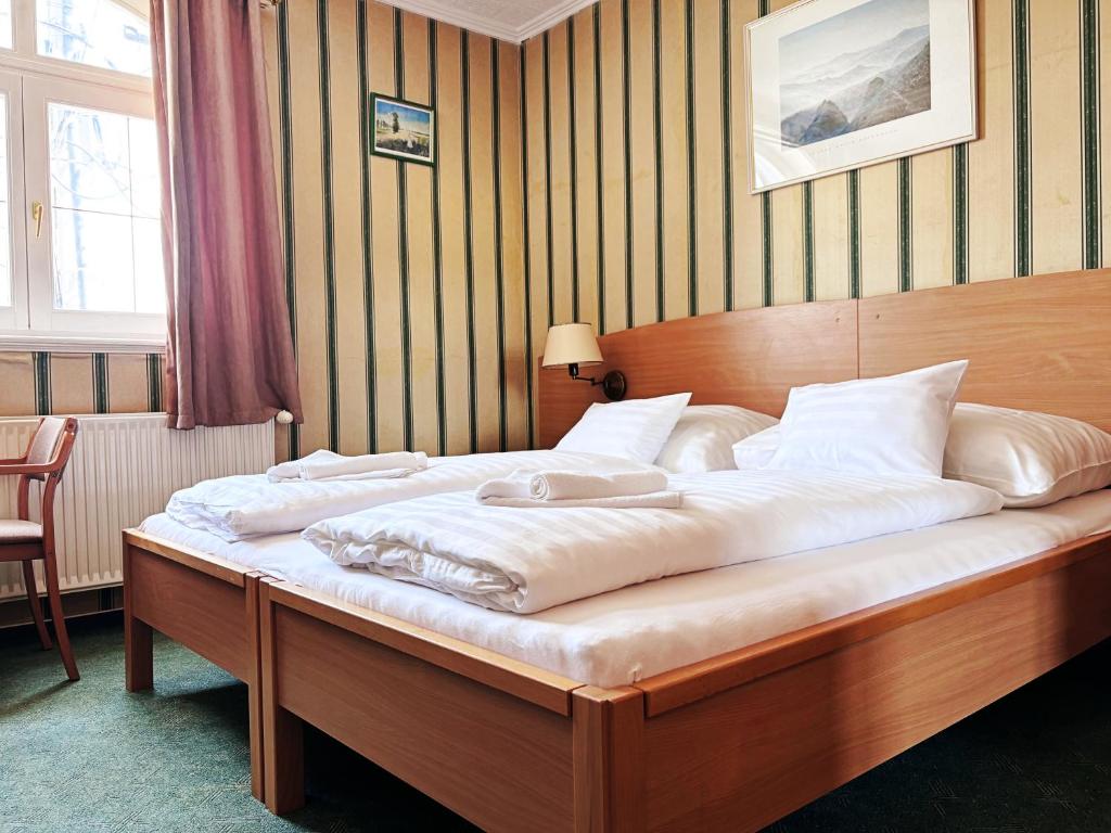 Postel nebo postele na pokoji v ubytování Levendula Resort és Rendezvényközpont