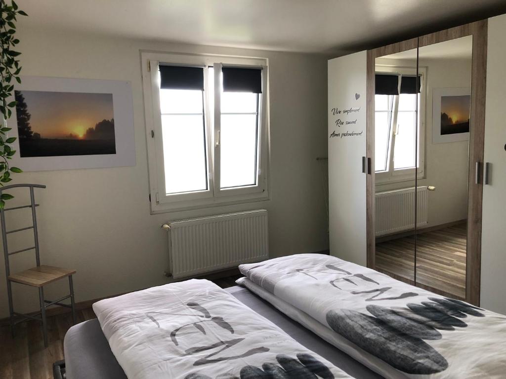Postel nebo postele na pokoji v ubytování Chez Nous