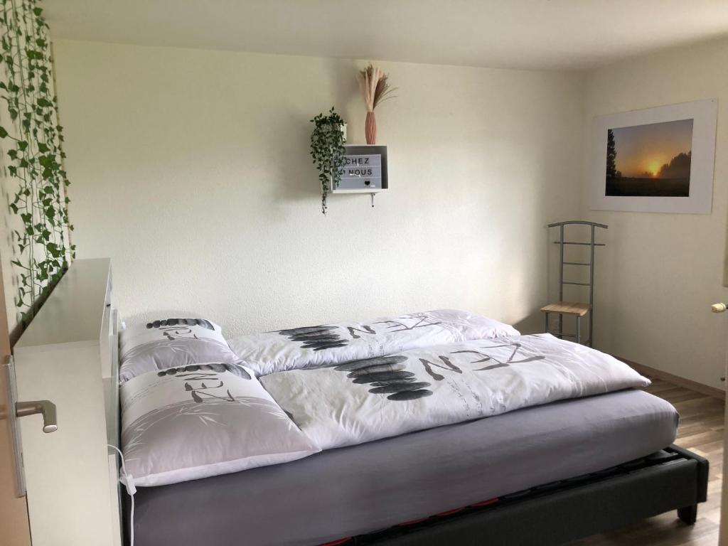 Postel nebo postele na pokoji v ubytování Chez Nous