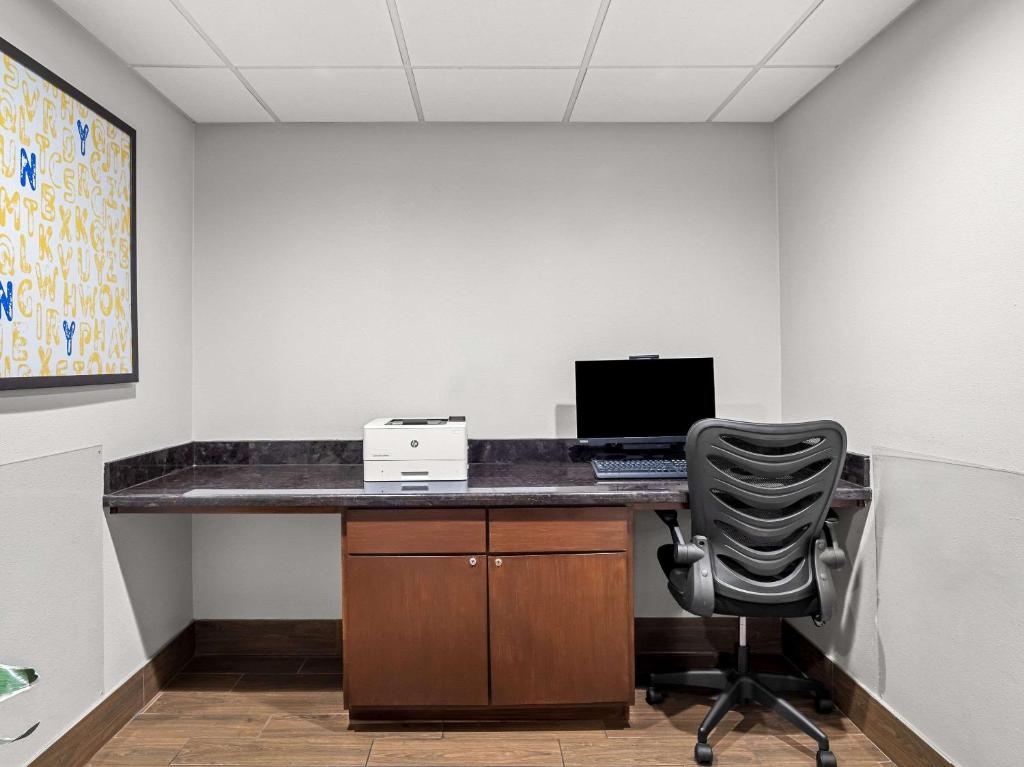 an office with a desk with a computer and a chair at Comfort Suites Lindale in Lindale