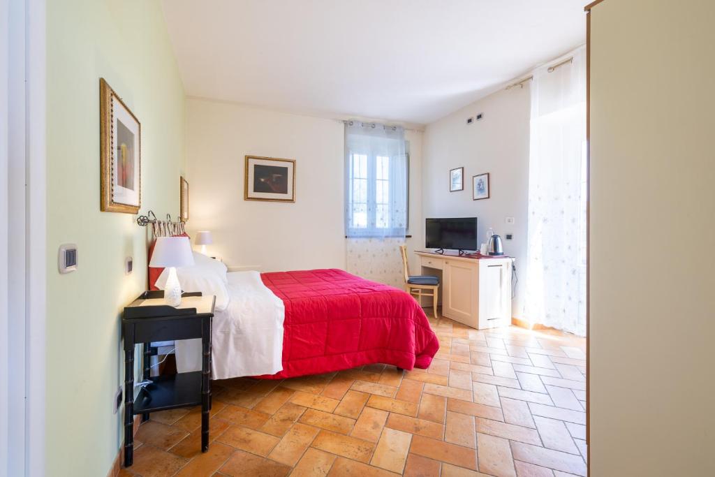 Postel nebo postele na pokoji v ubytování Agriturismo Corte Benedetto