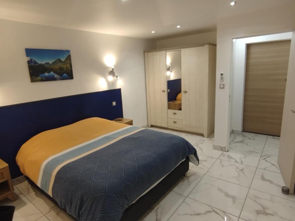 Postel nebo postele na pokoji v ubytování Les Cannes à Sucre de Plaiz'Anse