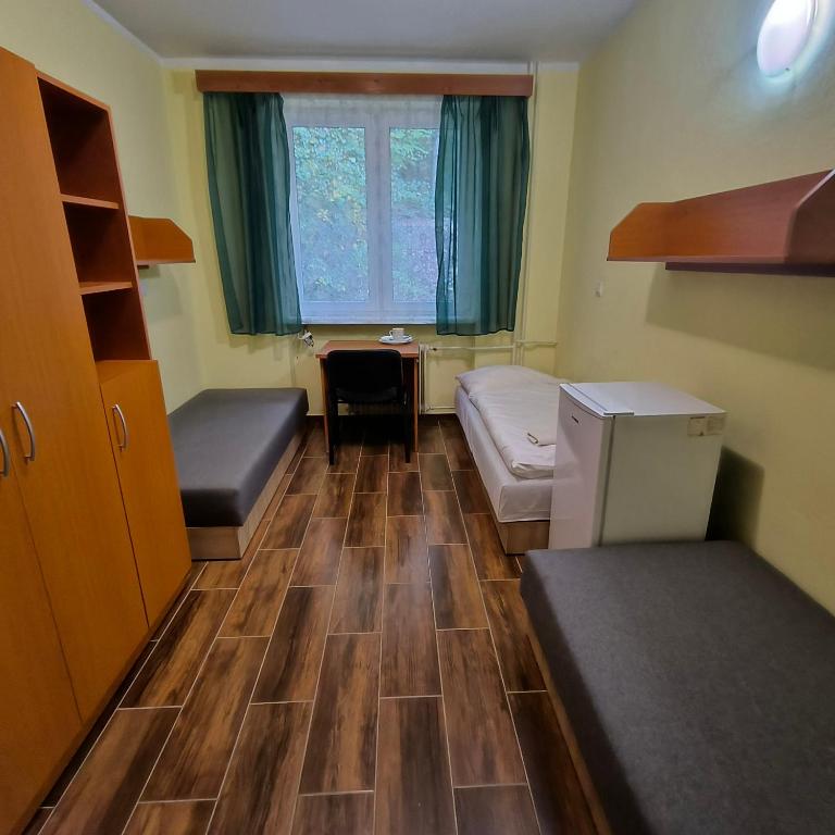 A bed or beds in a room at Rekreačné zariadenie Javorinka