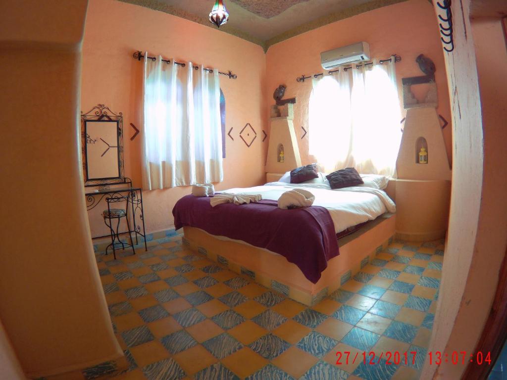 Postel nebo postele na pokoji v ubytování Riad Dar Poublanc
