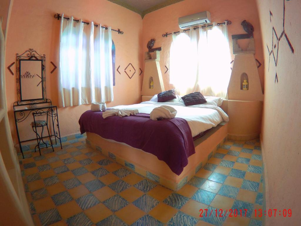 Postel nebo postele na pokoji v ubytování Riad Dar Poublanc