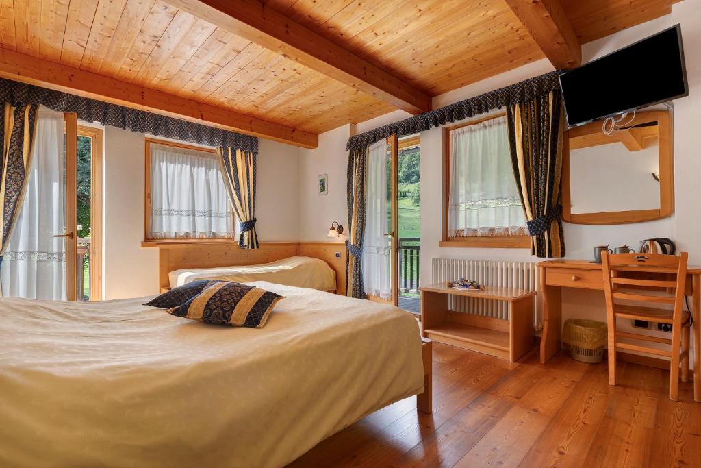 Postel nebo postele na pokoji v ubytování Agritur Maso Pan