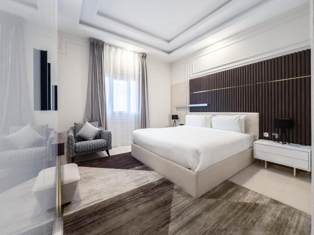 Postel nebo postele na pokoji v ubytování Abraj INN Royal 2 أبراج إن الملكي