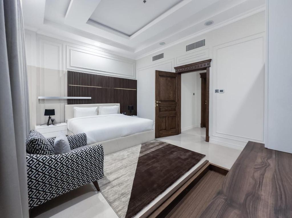 Postel nebo postele na pokoji v ubytování Abraj INN Royal 2 أبراج إن الملكي