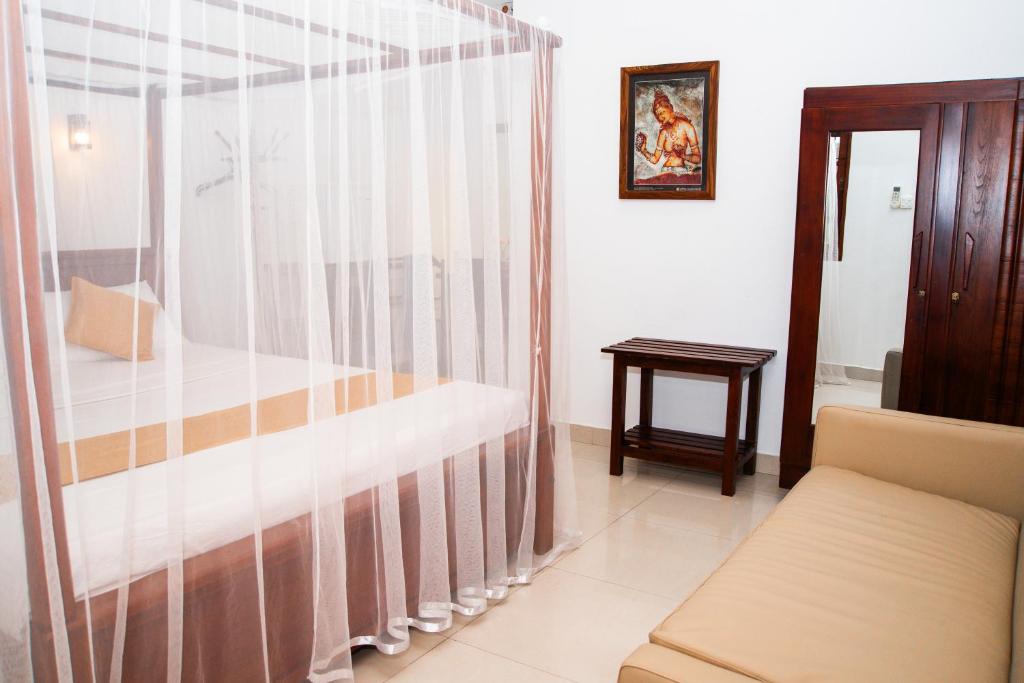 Postel nebo postele na pokoji v ubytování Angel Inn Guest House