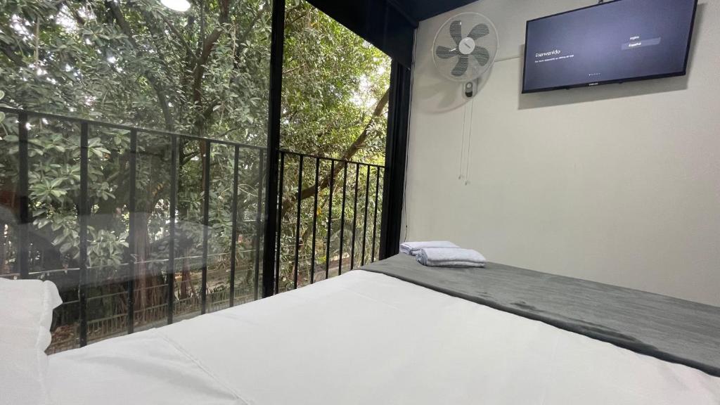 Postel nebo postele na pokoji v ubytování Hotel Casa Laureles Malibú
