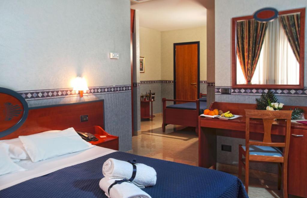 Postel nebo postele na pokoji v ubytování Hotel Kroma