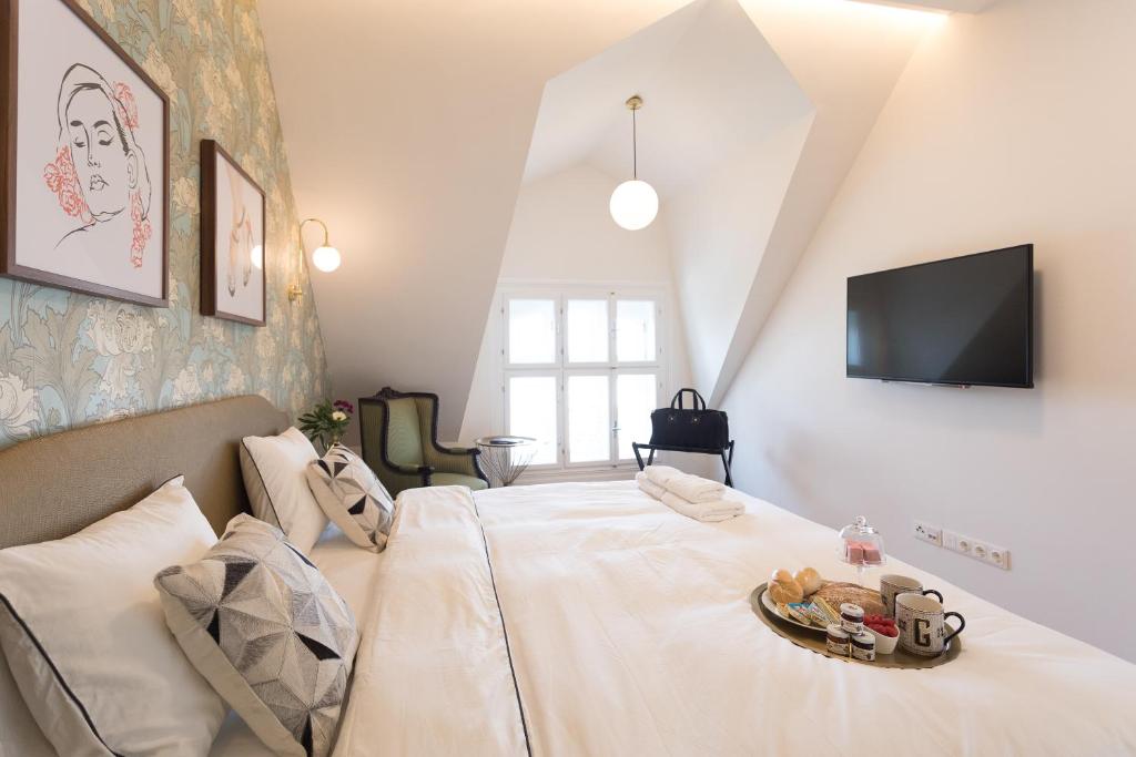 Postel nebo postele na pokoji v ubytování BOUTIQUE RESIDENCES at GAUDENZDORFER