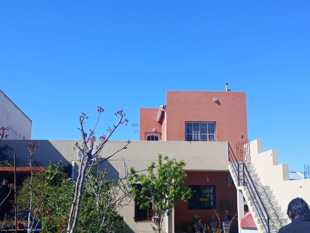 a building with a staircase on top of it at El Boulevard in Viedma